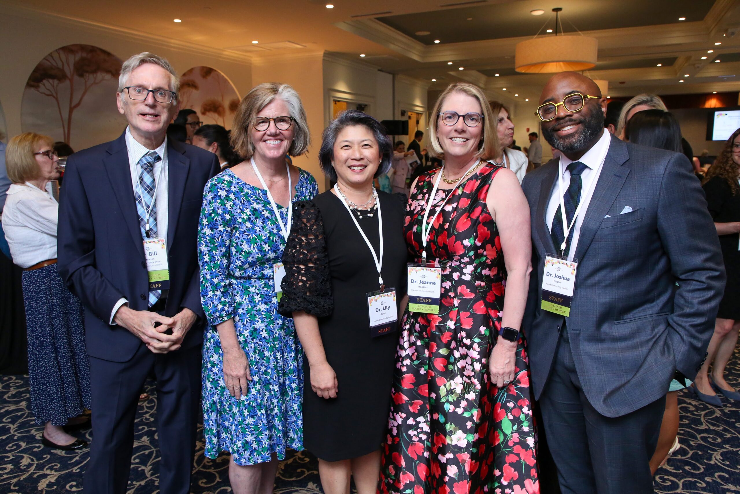 Figure 6: Left to Right: Dr. Bill Brandon; Mary Cahill; Dr. Lily Yung; Dr. Jeanne Hopkins; Dr. Joshua Okallo, Manet Providers at the June Bloom Gala