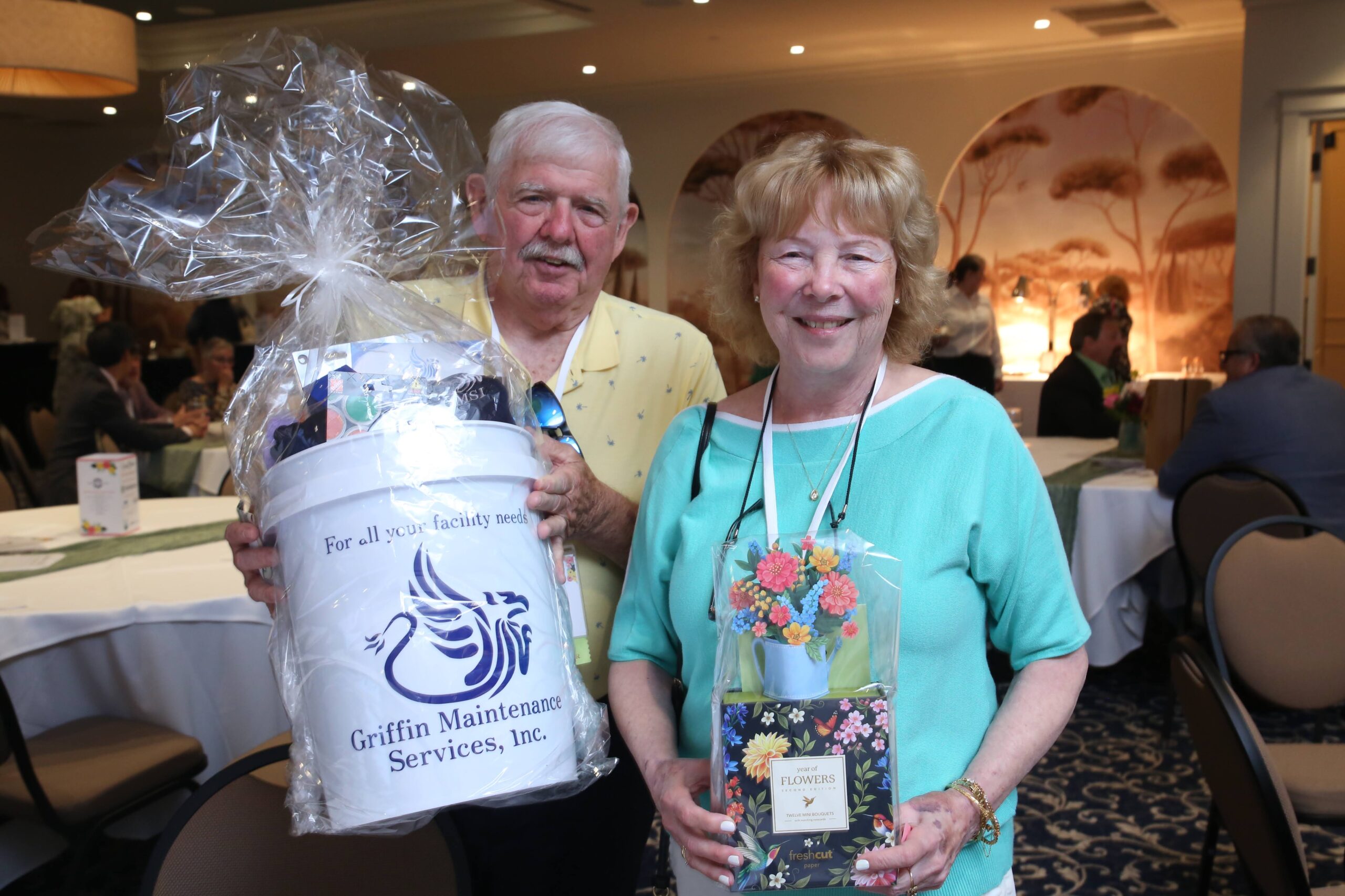 Figure 8: Robert and Julie Littlefield with auction and raffle prizes