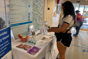 Person reading information at table